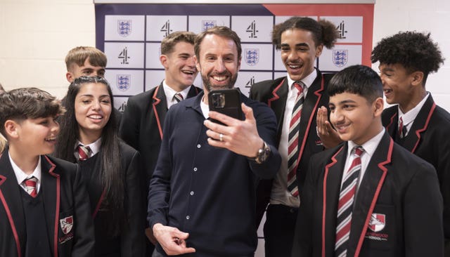 Gareth Southgate takes a selfie with students at a Channel 4 schools day