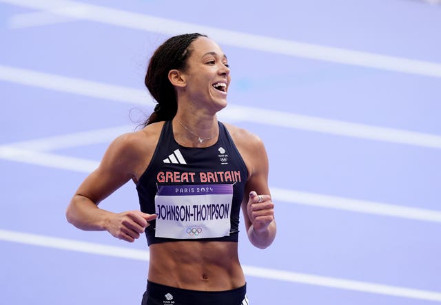 Great Britain’s Katarina Johnson-Thompson smiles after her 100m hurdles at the Stade de France