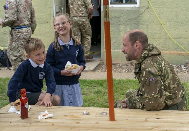 William speaks to Archie Foster, six, and his sister Ida, eight