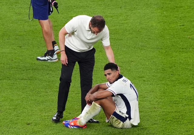 England manager Gareth Southgate commiserates with Jude Bellingham