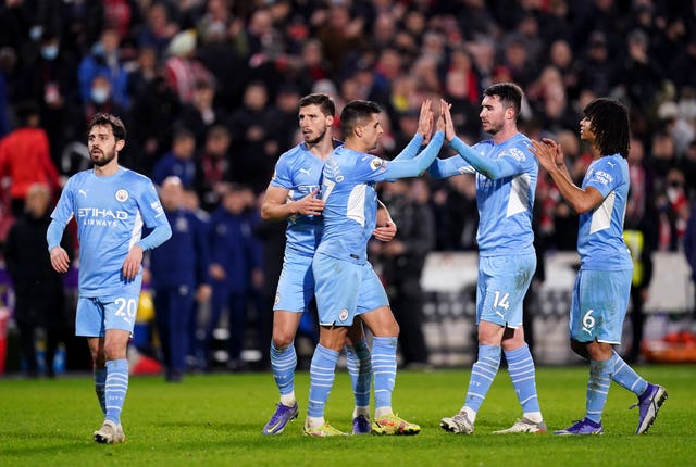 Manchester City players celebrate at full-time 