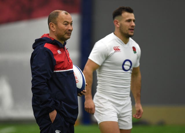 Danny Care stands near Eddie Jones during a training session