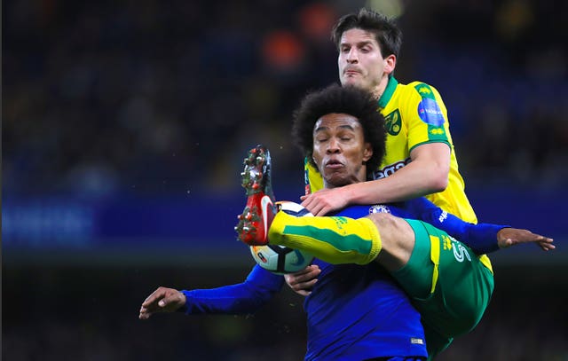 Chelsea’s Willian, left, was involved in an incident with Norwich's Timm Klose which the referee deemed was not a penalty