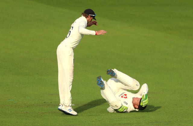 Jos Buttler, right, and Joe Root react to a missed chance