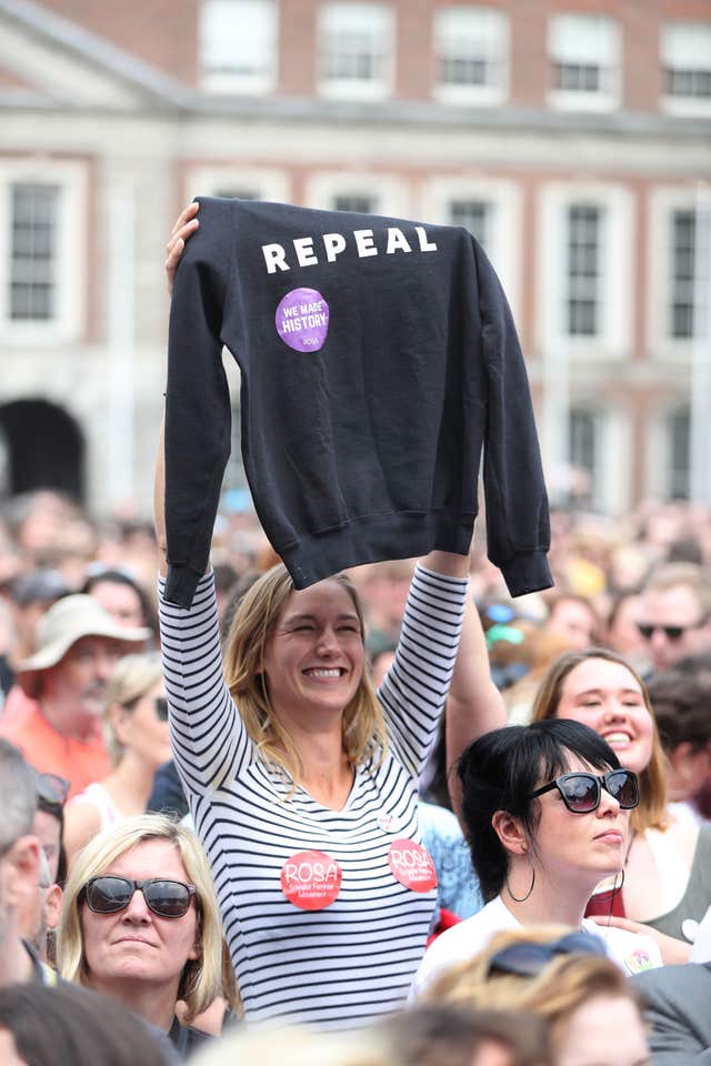 A Yes campaigner celebrates at Dublin Castle (Niall Carson/PA)