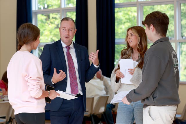 Stormont Education Minister Paul Givan speaks with pupils at Dromore High School in Dromore 