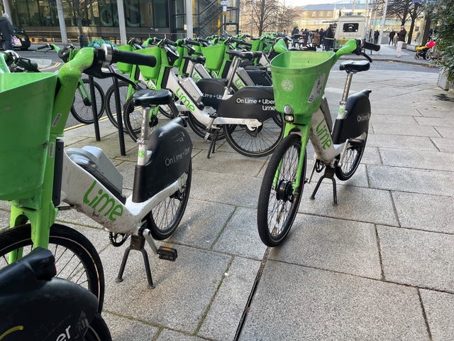 Lime and Forest e-bikes left on the pavement outside offices in Paddington, west London. Rental e-bike operators could be fined as part of measures to tackle “significant safety issues” around poor parking in London. Transport for London (TfL) published a new “enforcement policy” in response to widespread concerns about e-bikes blocking pavements. Picture date: Tuesday November 26, 2024.