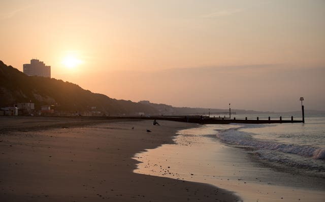 The sun rises over Bournemouth beach in Dorset