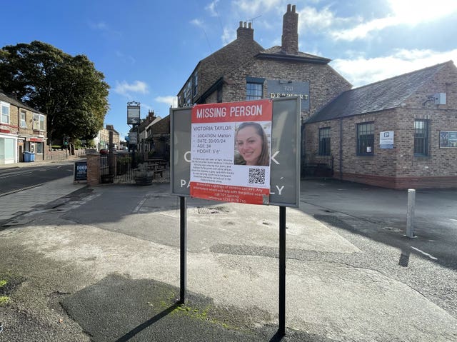 A poster appealing for information regarding missing woman Victoria Taylor outside the Derwent Arms public house in Malton