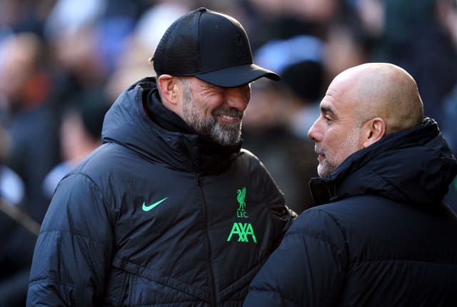 Manchester City manager Pep Guardiola (right) and Liverpool manager Jurgen Klopp 