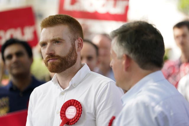 Danny Beales wearing Labour red rosette
