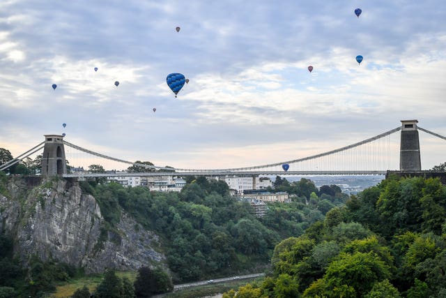 Balloons floating over the Clifton suspension bridge in Bristol