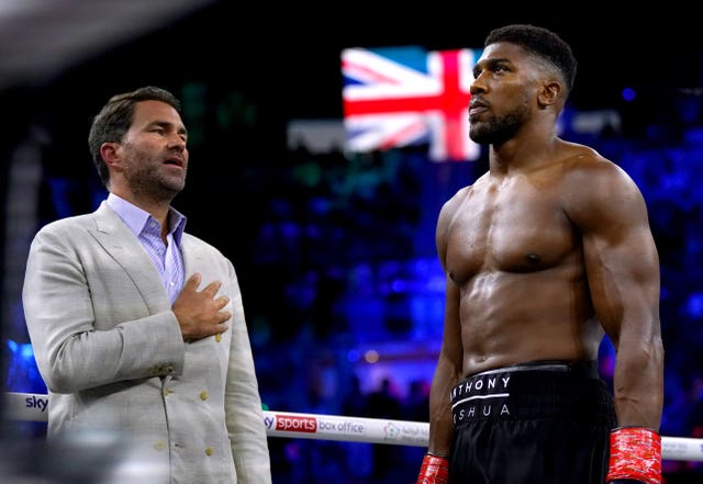 Anthony Joshua and Eddie Hearn during the national anthem