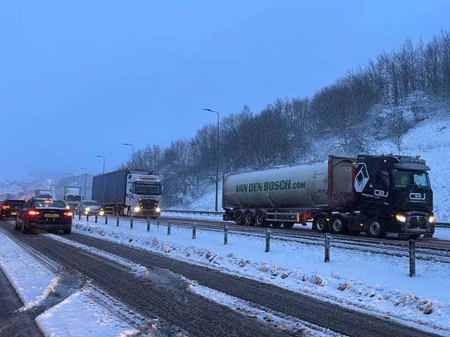 Lorries at a standstill on the M62 motorway near Kirklees, West Yorkshire, due to heavy snow in the area (PA)