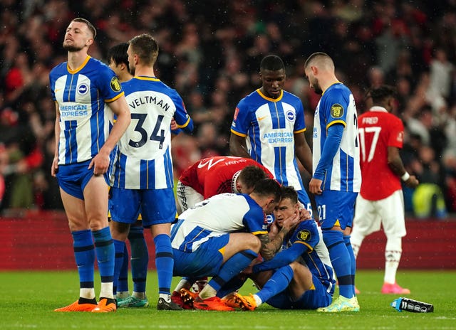 Brighton''s Solly March, second right, is consoled by team-mate Lewis Dunk and United''s Luke Shaw after missing his penalty in the shoot-out at Wembley