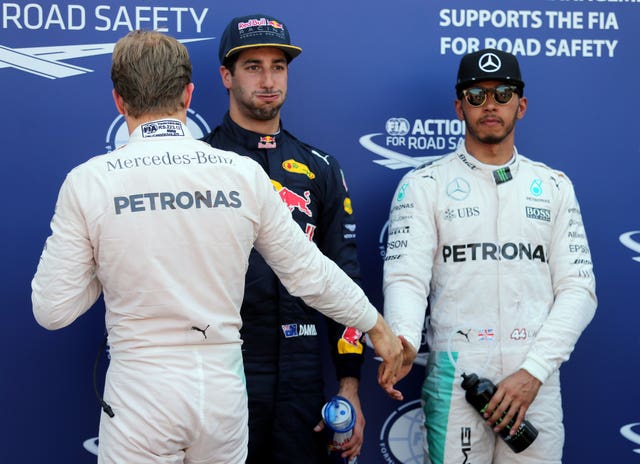 Lewis Hamilton shakes hands with former team-mate Nico Rosberg, with whom he endured a fractious relationship 