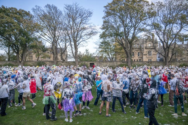 Students in fancy dress on university lawn