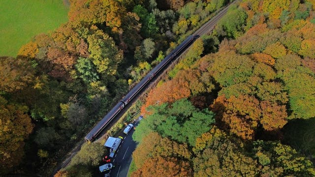 A view from above of emergency workers at the scene after a collision involving two trains