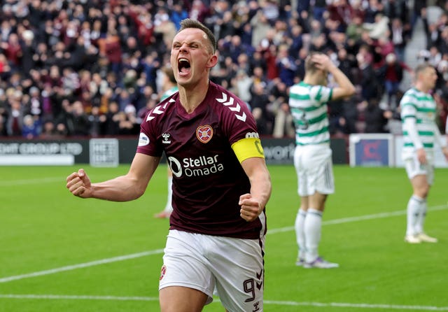 Hearts' Lawrence Shankland celebrates after his shot was turned in to his own goal by Celtic’s Dane Murray, not pictured