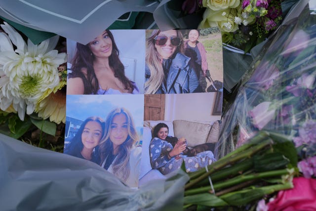 Pictures of victims and floral tributes