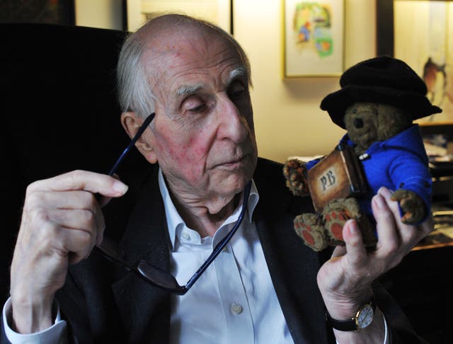 Michael Bond with a Paddington figure