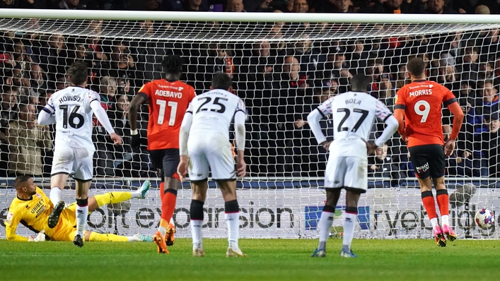 Luton Town’s Carlton Morris (right) scores their side’s second goal of the game from a penalty during the Sky Bet Championship match at Kenilworth Road, Luton. Picture date: Monday April 24, 2023.