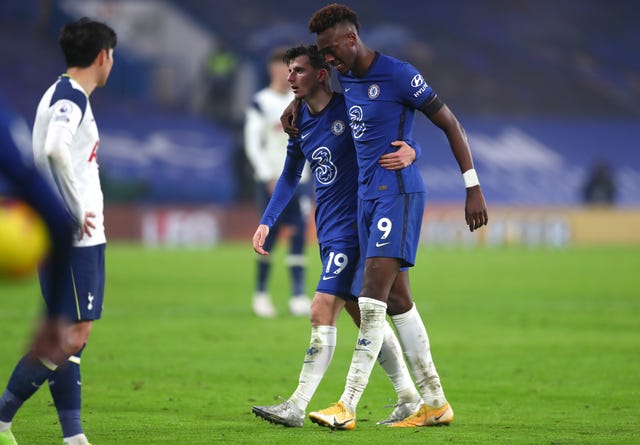Chelsea’s Tammy Abraham is helped by Mason Mount as he leaves the pitch after picking up an injury 