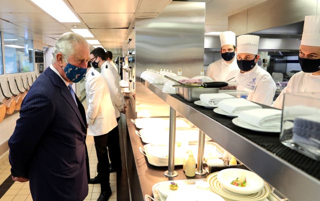 Charles casts his eye over Ritz staff at work. Chris Jackson/PA Wire