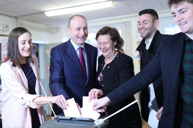 Fianna Fail leader Micheal Martin and family vote at St Anthony’s Boys National School in Ballinlough, Cork 