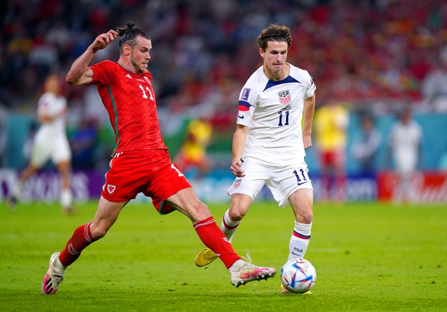 Wales’ Gareth Bale (left) and USA’s Brenden Aaronson battle for the ball