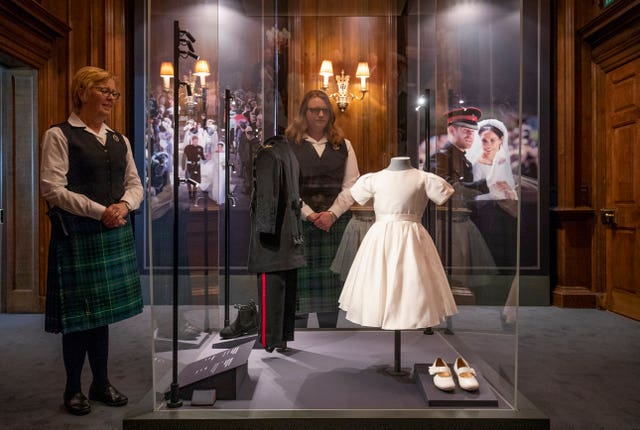 The wedding outfits worn by Prince George and Princess Charlotte in an exhibition at the Palace of Holyroodhouse, Edinburgh 