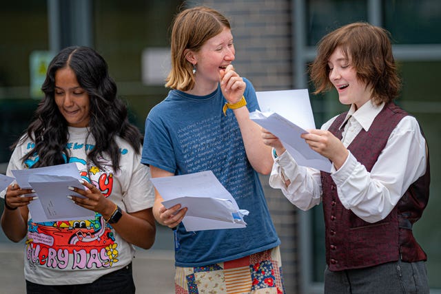 (from left) Anna Raveendran, 16, Grace Ford, 16, and Miriam McGrath, 16, celebrate their results at St Mary Redcliffe and Temple School (Ben Birchall/PA)