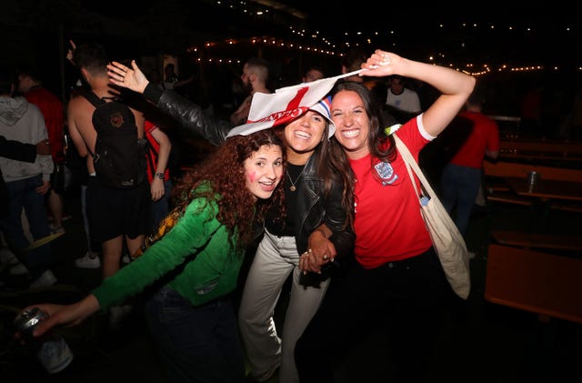 England fans at the Vinegar Yard in London Bridge celebrate reaching the Euro 2020 final