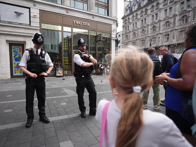 Police officers at the scene in Leicester Square