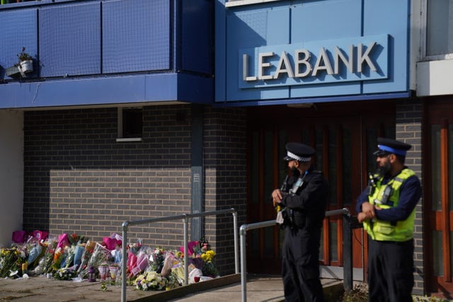 Tributes outside a flat block