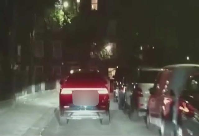 A screenshot from police footage of an Audi car being followed