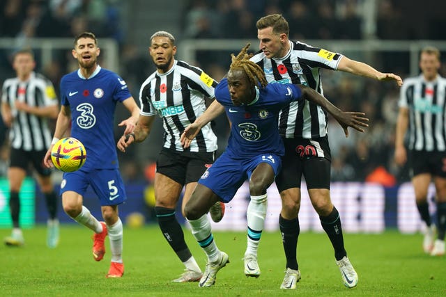 Trevoh Chalobah (left) and Chris Wood (right) battle for the ball