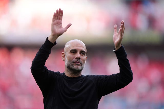 Pep Guardiola applauds the Manchester City fans after their FA Cup semi-final win over Nottingham Forest