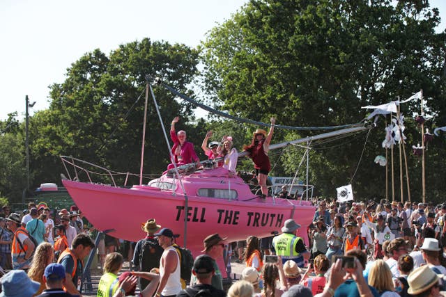 Extinction Rebellion's Tell The Truth boat was at the march (Yui Mok/PA)