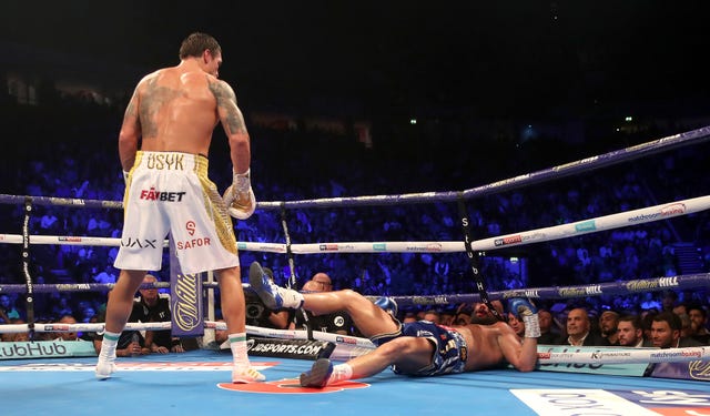 Tony Bellew, right, is sent crashing to the canvas in the eighth round as his bid to overcome undisputed cruiserweight champion Oleksandr Usyk ended in heartbreak