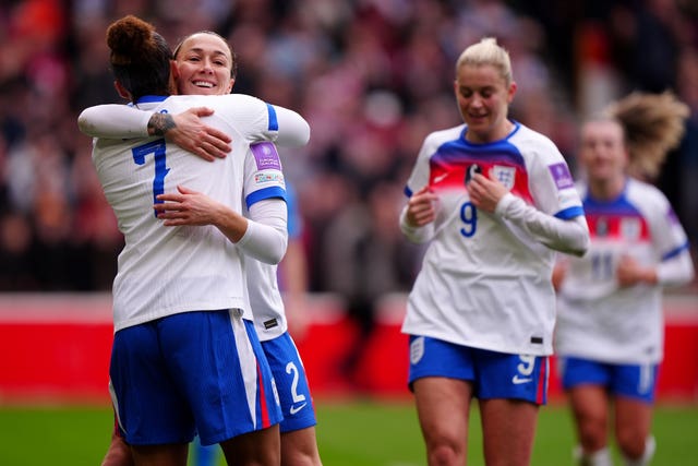 Lucy Bronze, second left, celebrates with team-mate Lauren James 