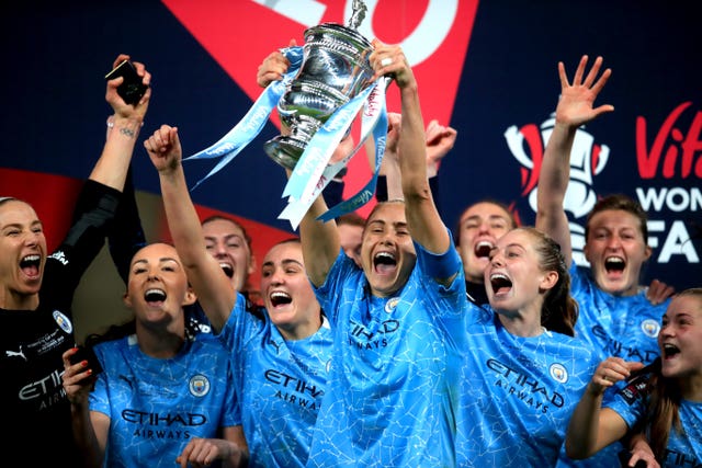Manchester City captain Steph Houghton lifts the Women's FA Cup for the third time in four seasons. City retained the cup following a 3-1 extra-time victory over Everton in November's behind-closed-doors clash at Wembley. Goals from Georgia Stanway and Janine Beckie earned victory after Everton's Valerie Gauvin cancelled out a first-half header from Sam Mewis to force the additional period