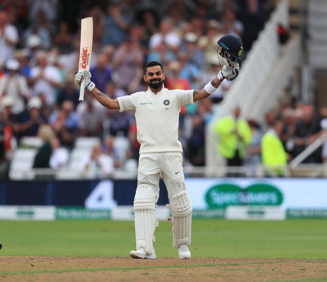 Virat Kohli celebrates making a century against England
