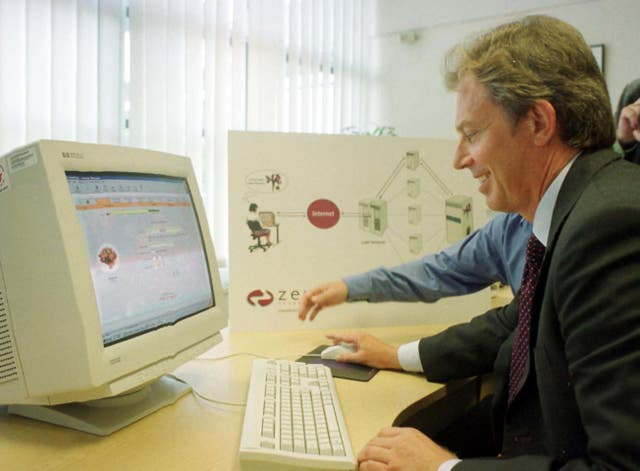Tony Blair using the internet to send his wife a bunch of flowers (Michael Stephens/PA)