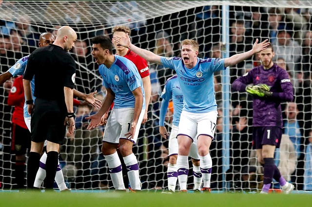 Manchester City trail Liverpool by 14 points after defeat in the Manchester derby
