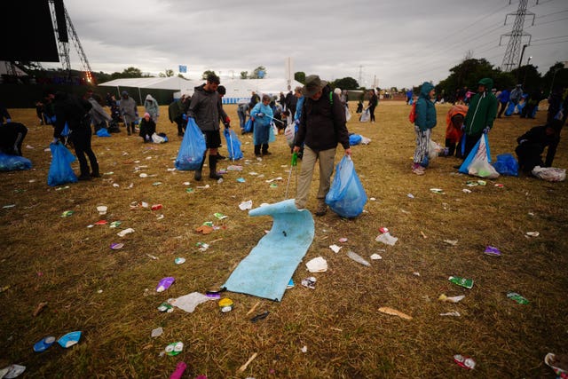 Litter pickers work to clear Worthy Farm