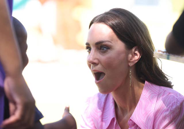 Kate reacts to a child