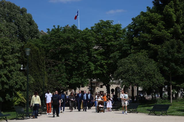 Taoiseach Michael Martin makes his way to the Jardins des Champs Elysee in Paris, France, for a press conference after his meeting with French President Emmanuel Macron
