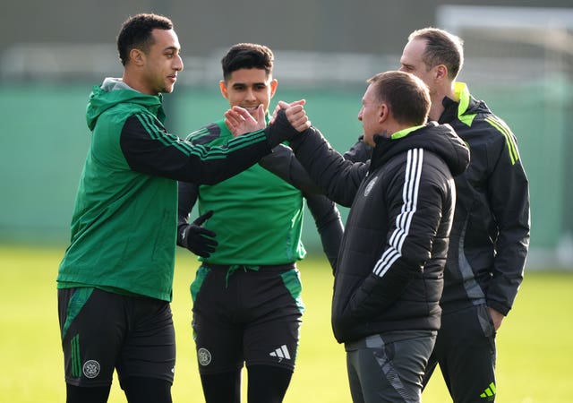 Celtic manager Brendan Rodgers with Adam Idah and Luis Palma during a training session