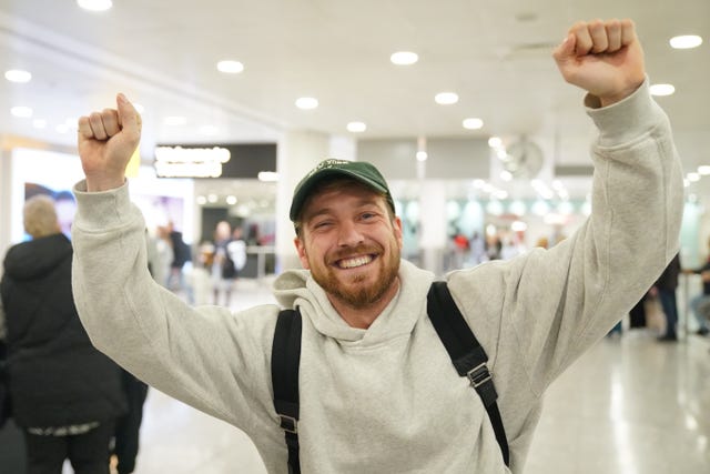 Sam Thompson arrives at Heathrow airport
